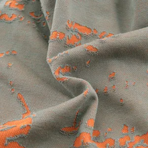Vue rapprochée détaillée de la texture du tissu de bonnet en tricot coloré élégant.
