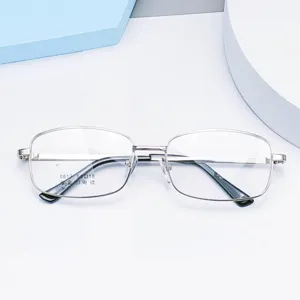Men's square metal optical glasses frame with thick gold plating and acetate temple tips detail.