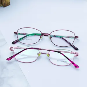 Metal optical glasses frames for women, pink full-frame stylish prescription eyewear detail view.