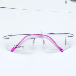 Rimless beta-titanium optical eyeglasses frame with stylish pink temples and rectangle lenses.