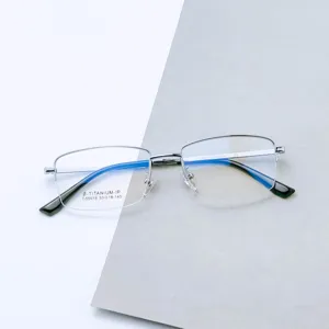 Detail view of men's half-rim titanium eyeglasses frame, stylish business optical eyewear.