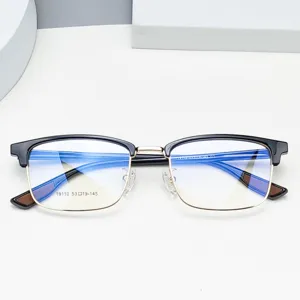 Men's half-rim optical glasses frame with clear demo lenses, stylish black and gold design.