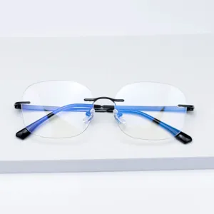Lunettes anti-lumière bleue minimalistes sans monture avec branches élégantes et verres clairs.
