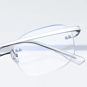 Monture de lunettes design sans monture en pur titane avec verres taillés pour femmes et hommes.