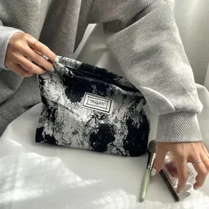 Black and white patterned cosmetic bag portable canvas makeup pouch chic travel clutch.