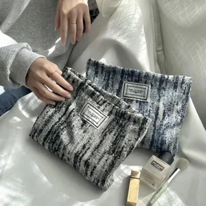 Stylish retro striped makeup pouch, portable canvas cosmetic bag for women daily use.
