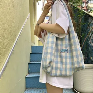 Blue and white plaid canvas tote bag detail view, casual style everyday shoulder bag.