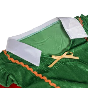 Christmas costume clothing detail view showing green velvet fabric, white collar and bow.