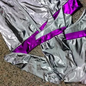 Close-up shot of the metallic silver and purple futuristic space costume detail and hood.