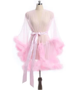Pink sheer mesh robe with fluffy feather trim and satin belt detail for evening wear.