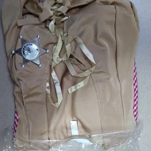 Western cowboy costume detail, brown lace-up top with sheriff badge and plaid trim.