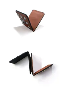 Skull PU leather golf wallet and magnetic coin purse with metal studs in punk style.