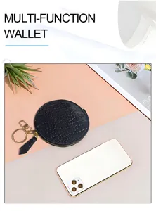 Mini round black crocodile leather coin purse with keychain, multi-function zipper wallet detail.