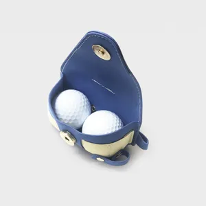 Sac de balle de golf portable avec deux balles, sac de taille en cuir bleu et blanc.