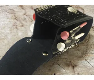 Black crocodile pattern cowhide golf tee waist bag featuring metal snaps and tees.
