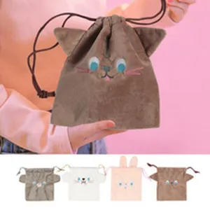 Plush cat ear drawstring pouch detail, soft velvet material with cute embroidered facial expressions.
