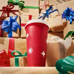 Red 16oz reusable coffee cup with white lid and festive star pattern for daily use