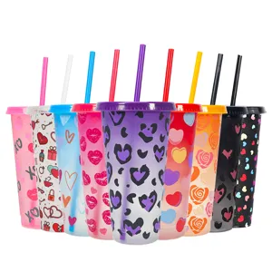 Detail view of 24oz color changing plastic cold cups with straws and lovely Valentine's patterns.