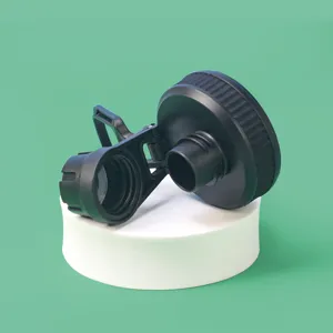 Detailed view of a durable black plastic water bottle cap with handle and secure seal mechanism.