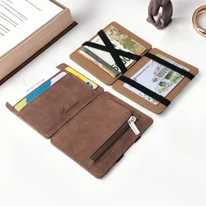 Portefeuille magique en cuir nubuk avec porte-cartes, poche zippée et bande élastique.