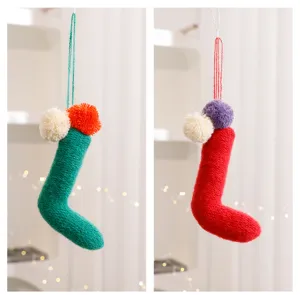 Knit Christmas stocking hanging detail, colorful pompom decoration, cozy holiday ornament.