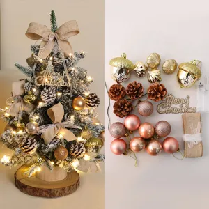 Mini Christmas tree DIY accessory kit with baubles, pine cones, and lights for desktop decor.