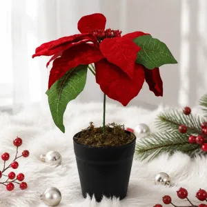 Artificial Christmas poinsettia potted plant indoor festive holiday home decoration detail view