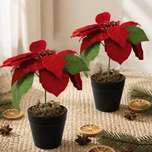 Artificial red poinsettia Christmas potted plants with black pots for holiday decor.