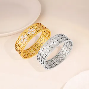 Stainless steel wide cuff bracelet set featuring a hollow floral lattice design with sparkly crystal stones.