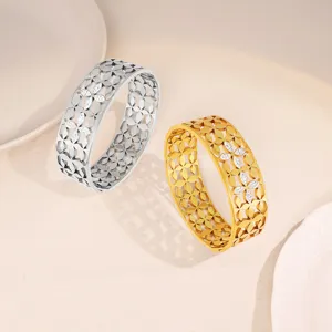Wide stainless steel cutout floral crystal bangle bracelet, elegant fashion jewelry for women.
