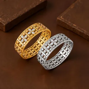 Wide stainless steel hinge clover bangle bracelet with sparkling crystal stones in gold and silver.