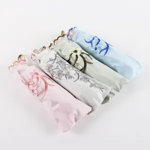 Floral embroidered folding sun umbrella with solid wood handle, multi-color compact umbrella.