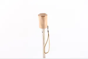 Solid wood handle detail of UV protection sun umbrella, showing close-up of parasol design.