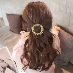 Elegante fermaglio per capelli rotondo geometrico irregolare in metallo per donna, accessorio chic.