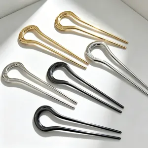 Detailed close-up showing smooth metallic alloy U-shaped hairpins in gold, silver and black.