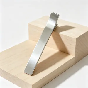Minimalist metal hair clip detail, sleek brushed finish barrette for elegant hairstyles.
