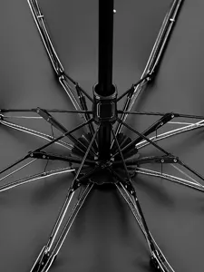 Close-up view of the folding umbrella internal structure showcasing the sturdy black ribs.