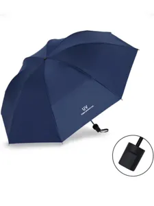 Detail shot of the dark blue folding sun umbrella handle and UV protection fabric surface.