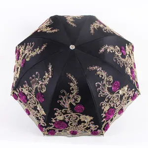 Black folding sun umbrella with gold and purple floral embroidery, UV protection lace parasol.