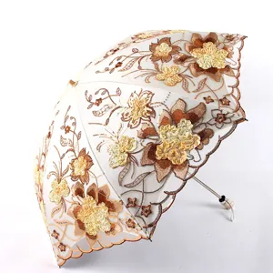 Elegant embroidered lace double layer sun umbrella with UV protection for daily use.