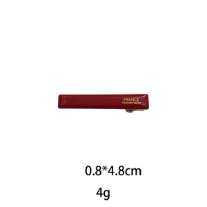 Red rectangular metal hair clip with handmade style design, compact size 0.8x4.8cm for daily use.