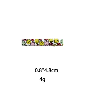 Cute smiley face and red lips hair clip detail view, mini size 0.8x4.8cm, lightweight accessory.
