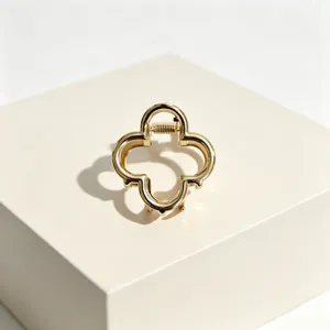 Gold four-leaf clover hair claw clip elegant alloy hair accessory for women styling detail