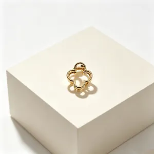 Golden clover metal hair claw clip detail shot, elegant fashion accessory for stylish girls.
