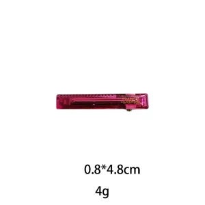 Transparent pink hair clip detail, compact 0.8x4.8cm size, lightweight accessory for styling.