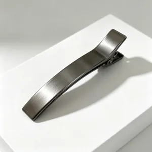 Minimalist metal hair clip for women, sleek dark grey duckbill clip, elegant daily hair styling accessory.