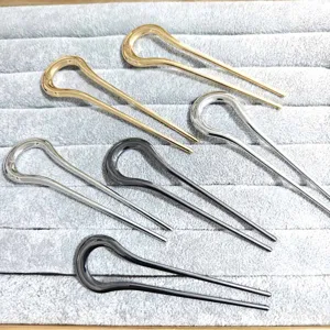 Minimalist metal U-shaped hairpins set, elegant curved hair forks for styling buns and updos.