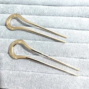 Gold alloy U-shaped hair fork simple hair accessory elegant hair stick for women detail view.