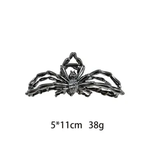 Detailed close-up view of the gothic metal spider hair claw clip, showing intricate texture.