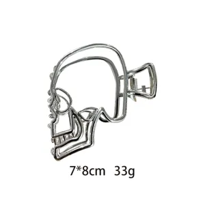 Gothic metal skull hair claw clip for women, vintage punk hair styling accessory 7x8cm.